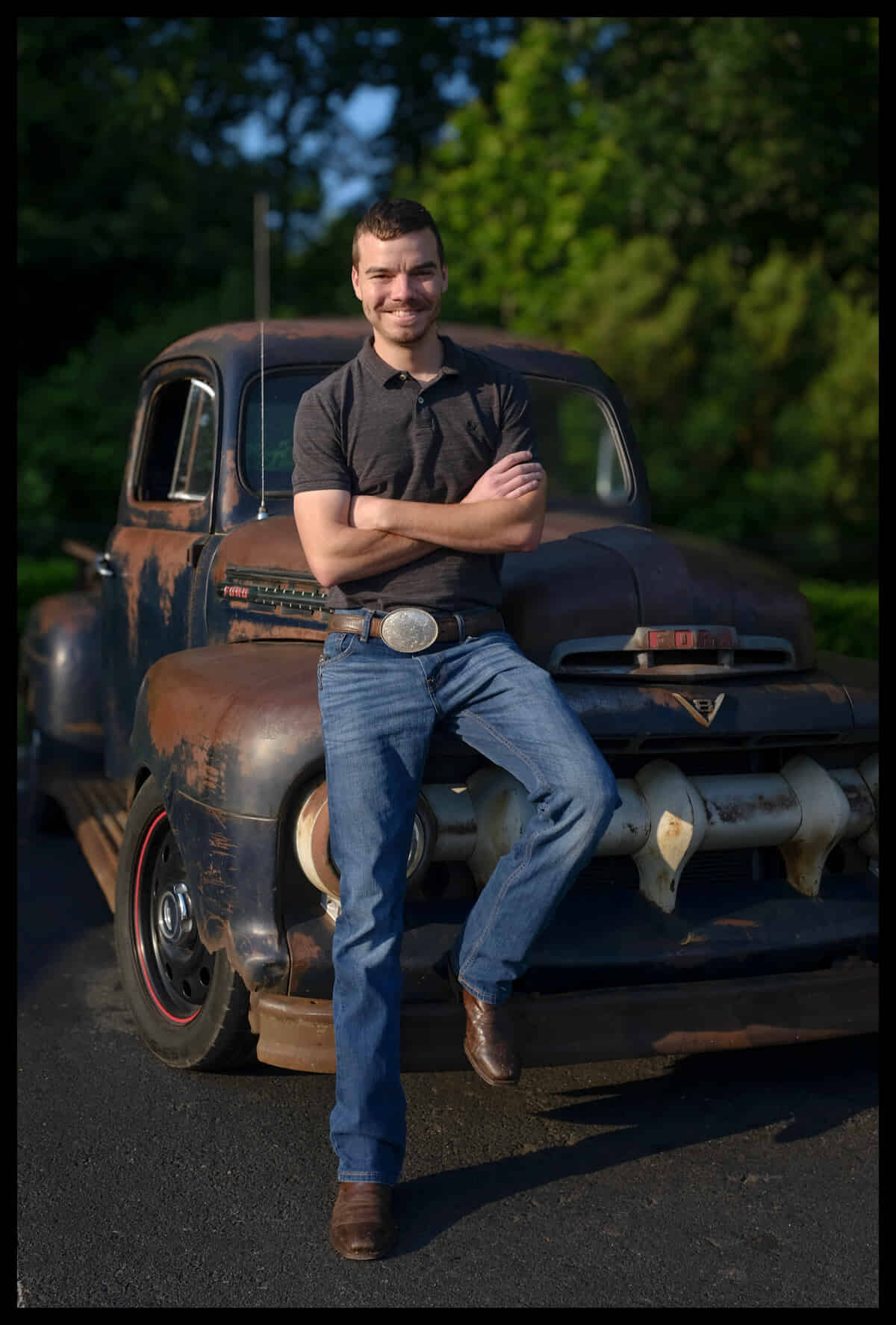Doug Parker shown leaning on the bumper of a class Ford truck